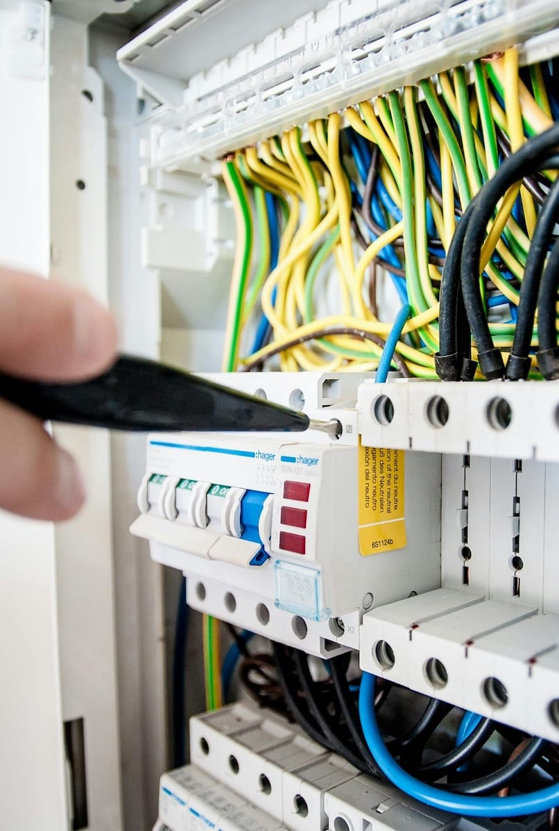 Electrician working on electrical circuit breaker panel