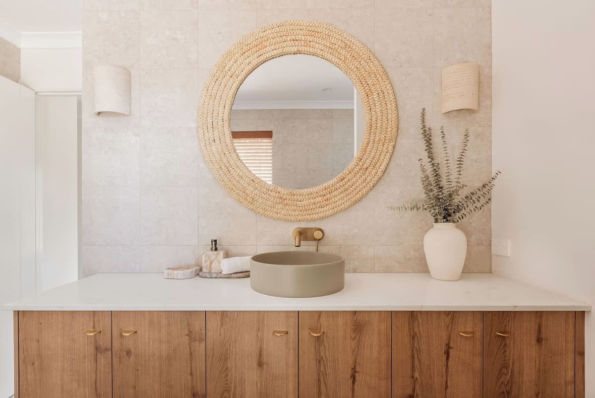 Modern bathroom vanity with round mirror and sink