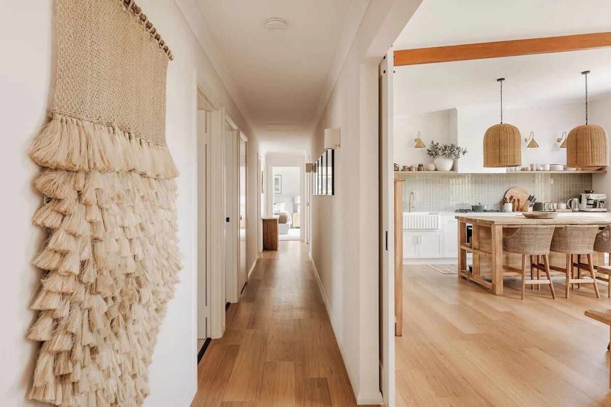 Modern hallway leading to cozy kitchen area
